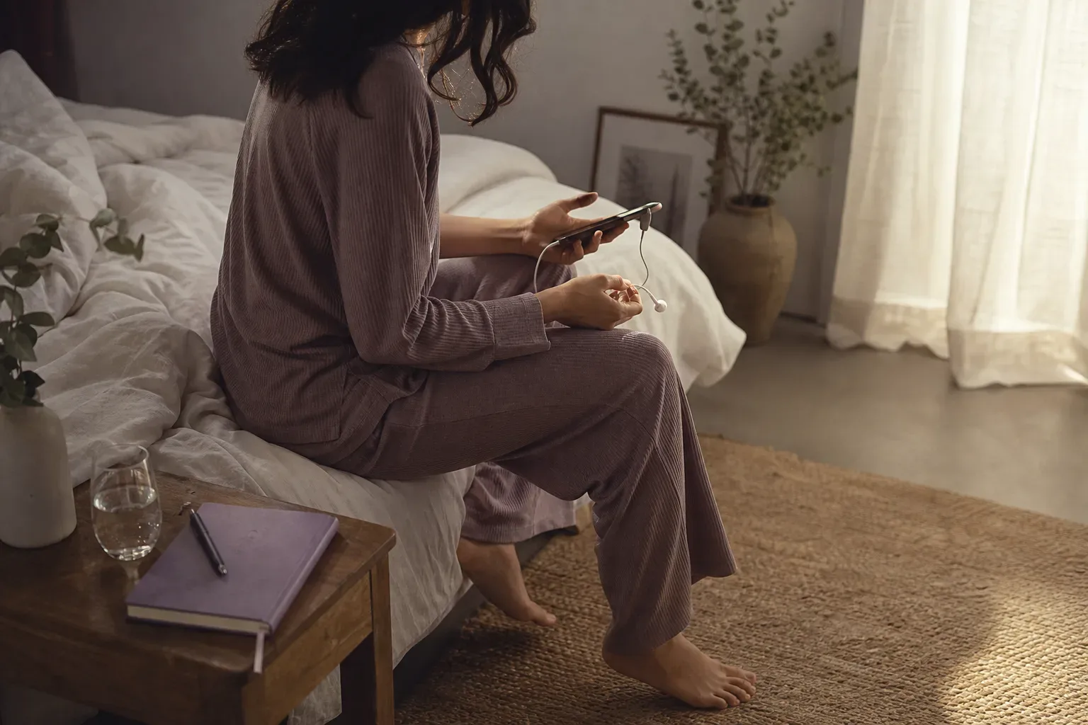 Woman listening quietly beside a morning window